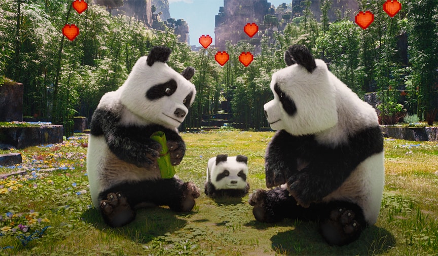 ハートが浮かぶ草原に、大人のパンダ2頭と子どものパンダがいる映画の場面